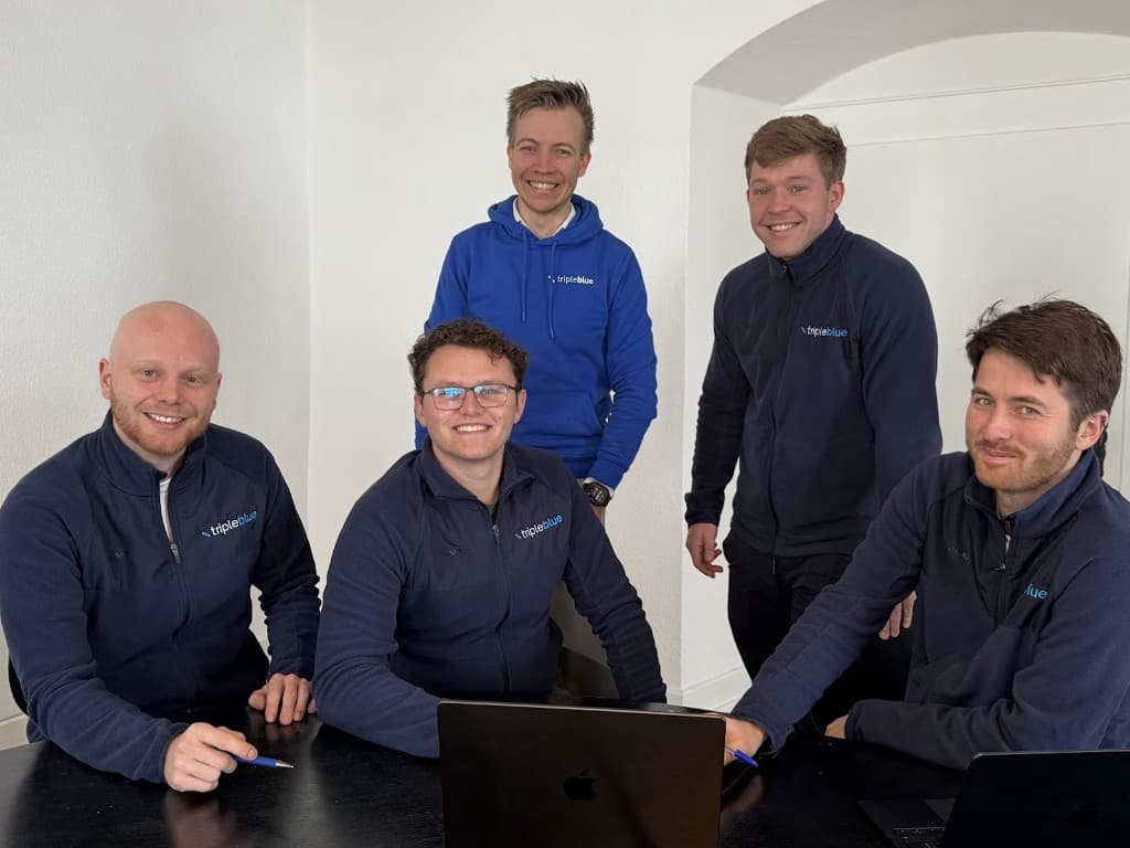 Tripleblue team in branded attire